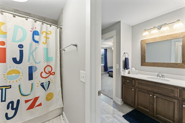 bathroom featuring vanity, ceiling fan, and tile flooring