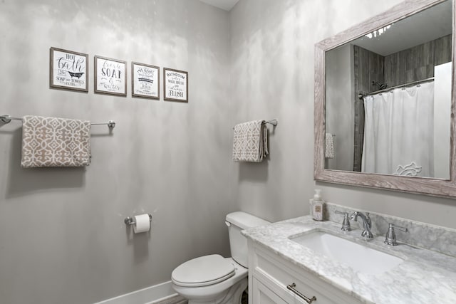 bathroom with toilet and vanity