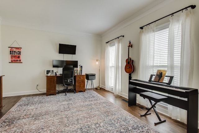 office with crown molding and dark hardwood / wood-style floors