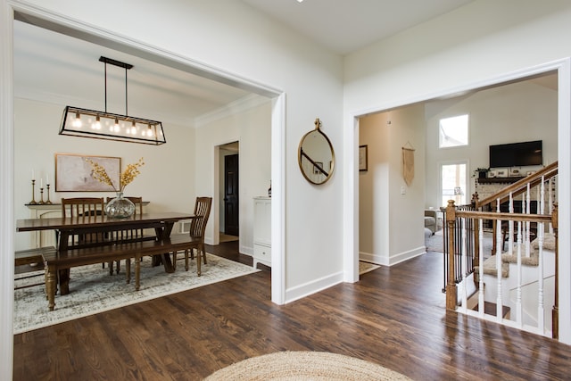 dining area featuring dark hardwood / wood-style flooring and an inviting chandelier