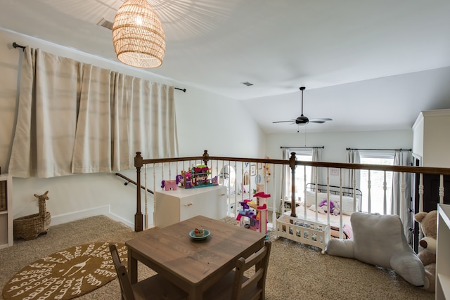 game room with light colored carpet, vaulted ceiling, and ceiling fan with notable chandelier