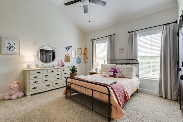 bedroom featuring ceiling fan, lofted ceiling, and light colored carpet