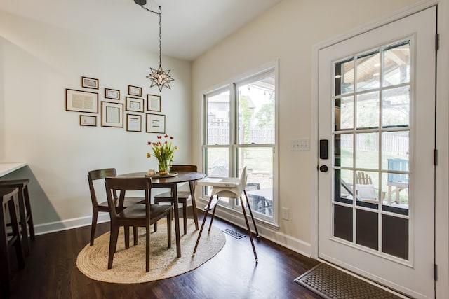 dining area featuring dark hardwood / wood-style floors