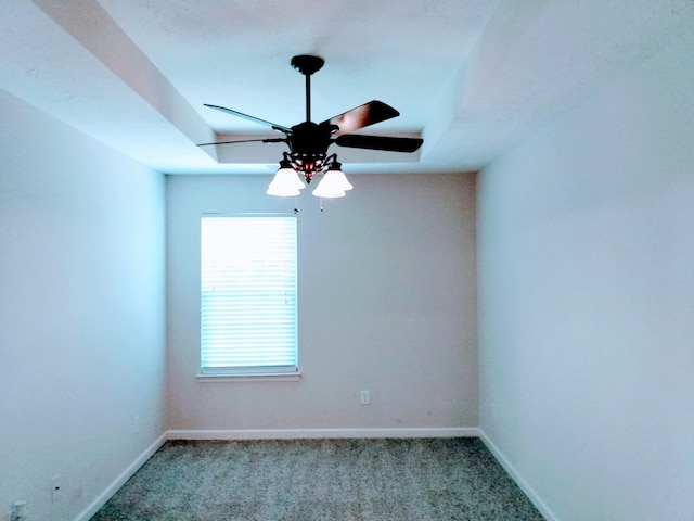 spare room with light carpet and ceiling fan