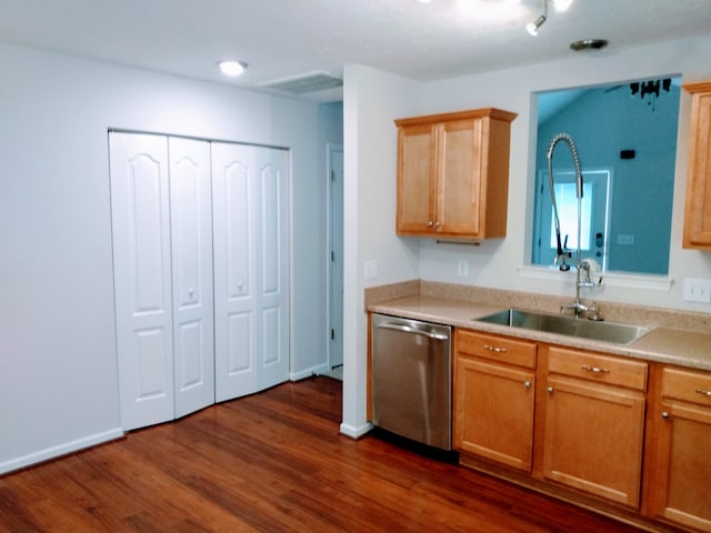 kitchen with sink, dark hardwood / wood-style floors, and dishwasher