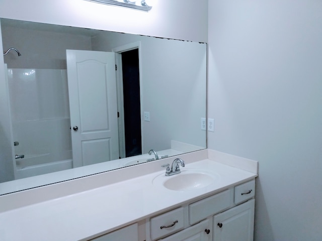 bathroom featuring shower / bathing tub combination and vanity