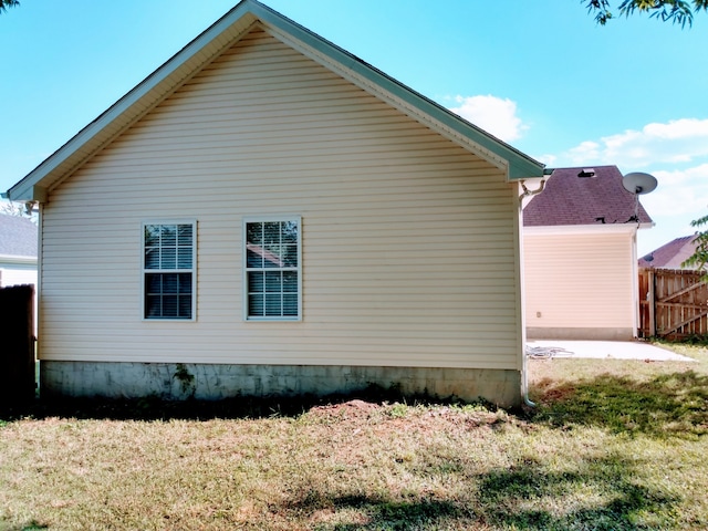 view of home's exterior featuring a lawn