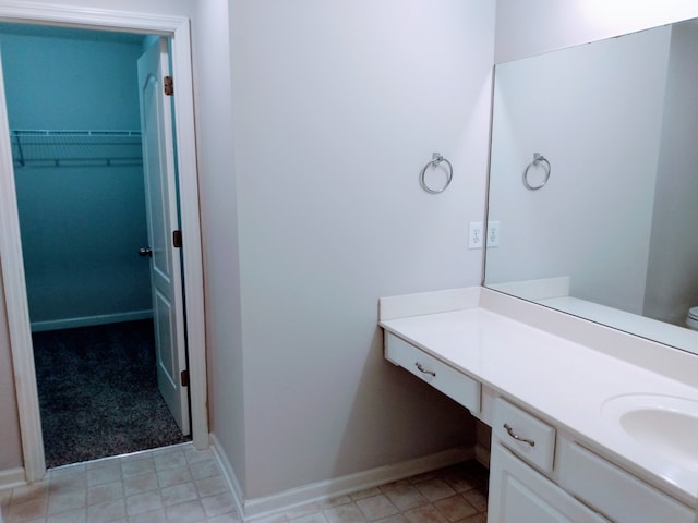 bathroom with tile flooring and vanity