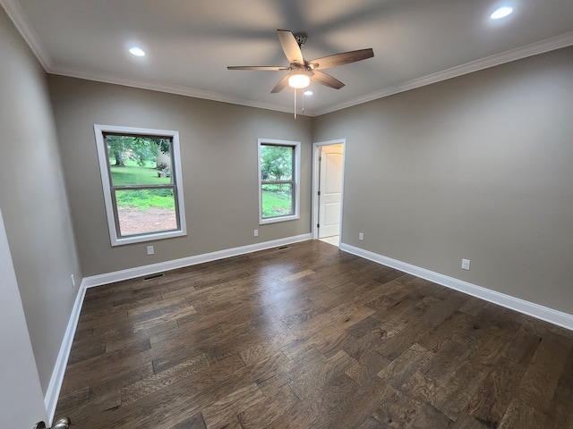 spare room with crown molding, dark hardwood / wood-style floors, and ceiling fan