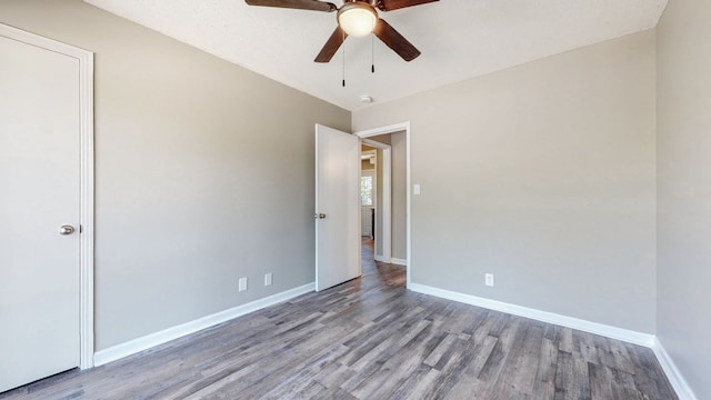 unfurnished room featuring ceiling fan and wood-type flooring