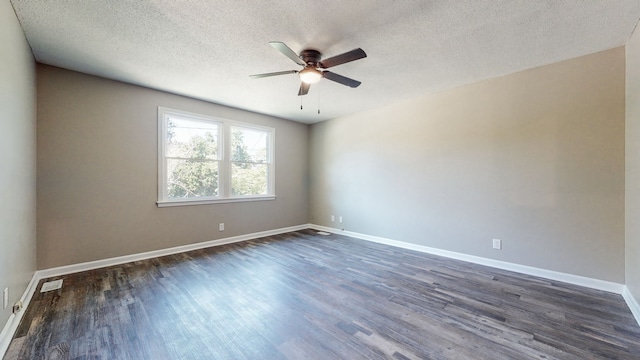 spare room featuring a textured ceiling, dark hardwood / wood-style floors, and ceiling fan