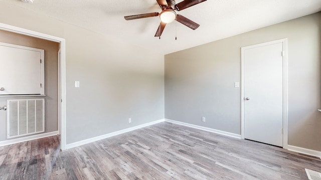 spare room with light hardwood / wood-style flooring and ceiling fan