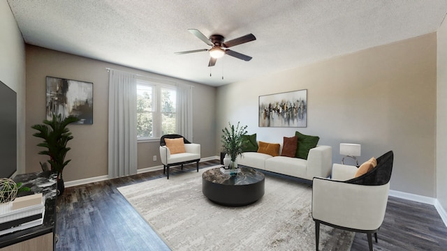 living room with ceiling fan, a textured ceiling, and dark hardwood / wood-style flooring