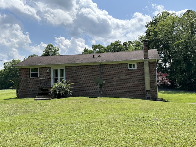 back of house with a yard