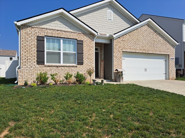 view of front facade featuring a front yard and a garage