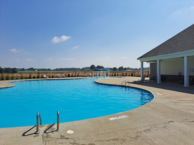 view of swimming pool featuring a patio