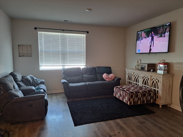 living room featuring dark hardwood / wood-style floors