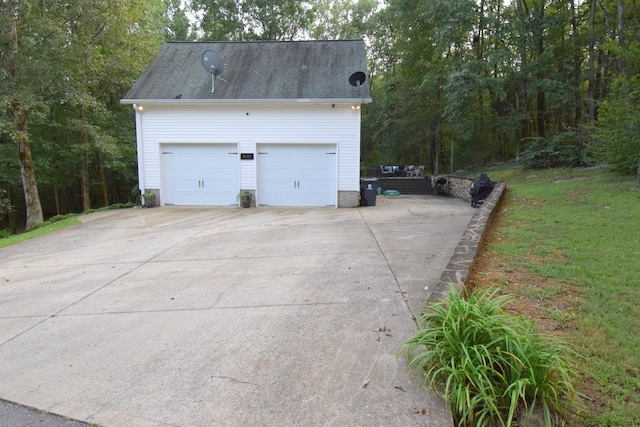 garage with a lawn