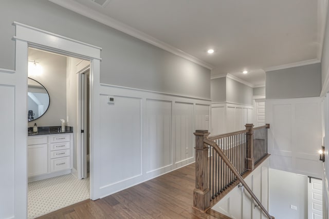 hallway with dark tile floors and ornamental molding