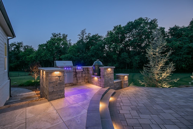 view of patio with a grill and an outdoor kitchen