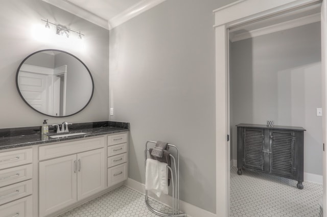 bathroom with tile flooring, vanity, and crown molding