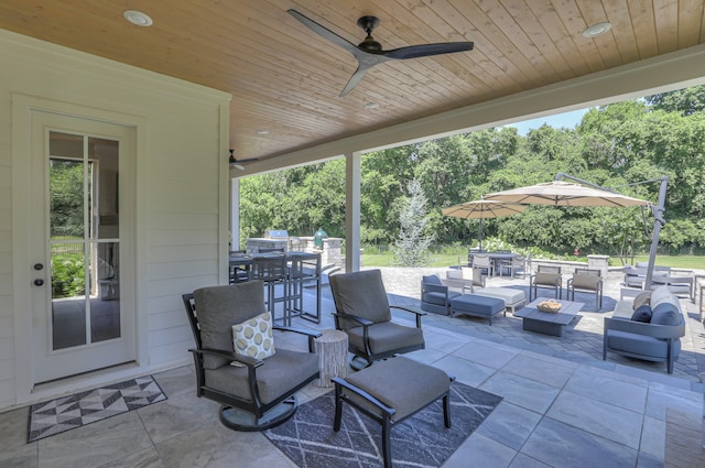 view of terrace featuring an outdoor living space and ceiling fan