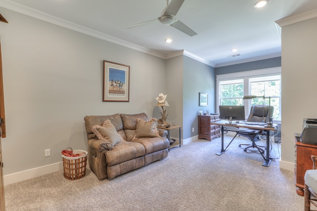 office area with ceiling fan, ornamental molding, and light colored carpet