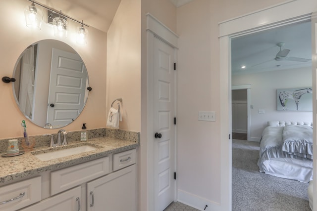 bathroom featuring ceiling fan and vanity