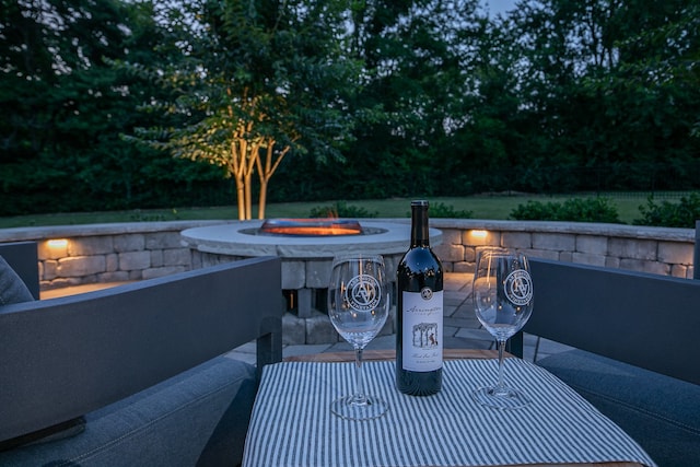 view of patio / terrace featuring an outdoor fire pit