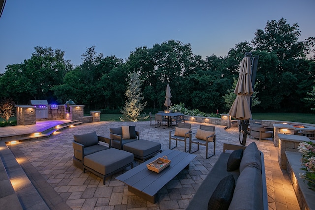 view of patio / terrace featuring a fire pit