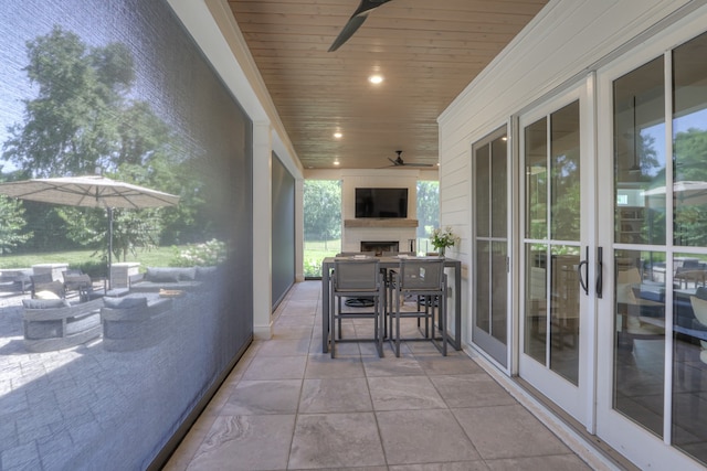 view of patio featuring ceiling fan