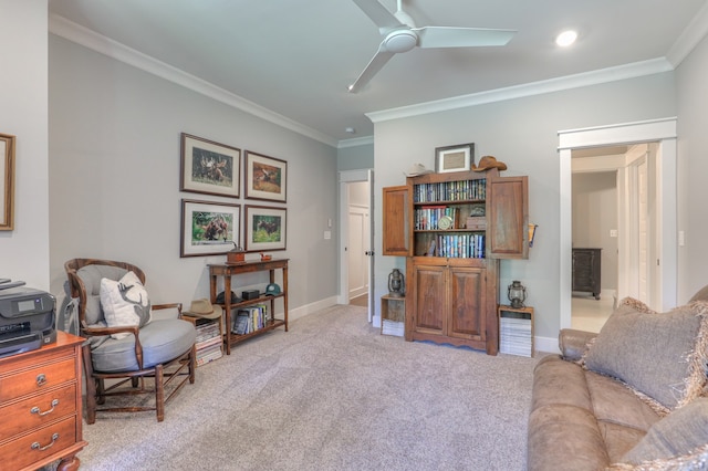 interior space featuring light colored carpet, ceiling fan, and crown molding