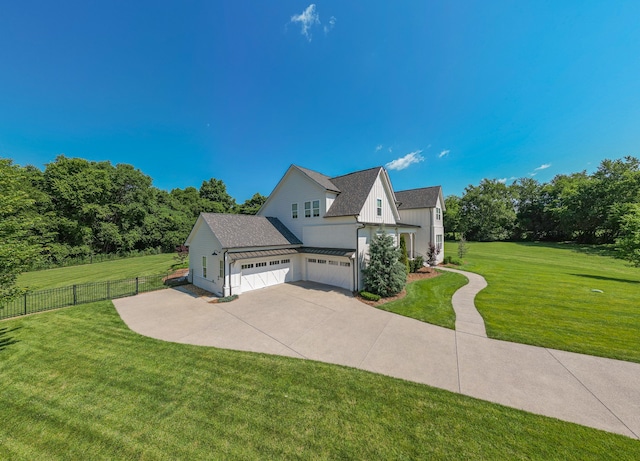 view of front facade featuring a front yard and a garage