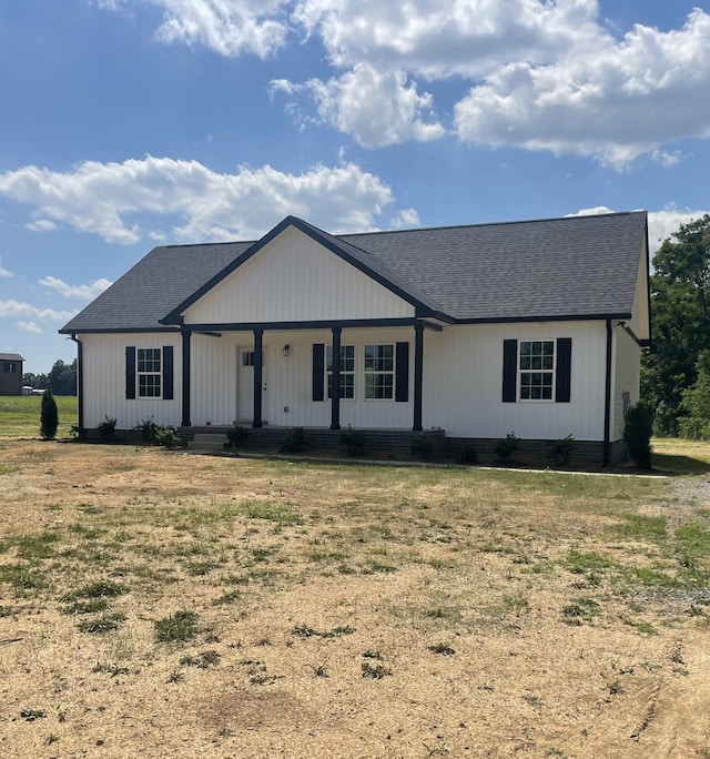 ranch-style house with covered porch