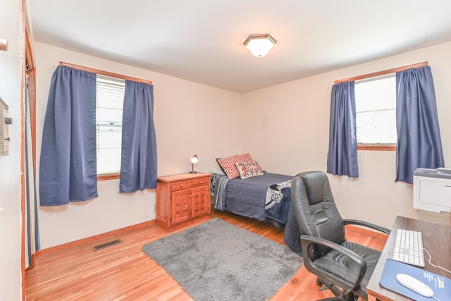 bedroom with hardwood / wood-style floors