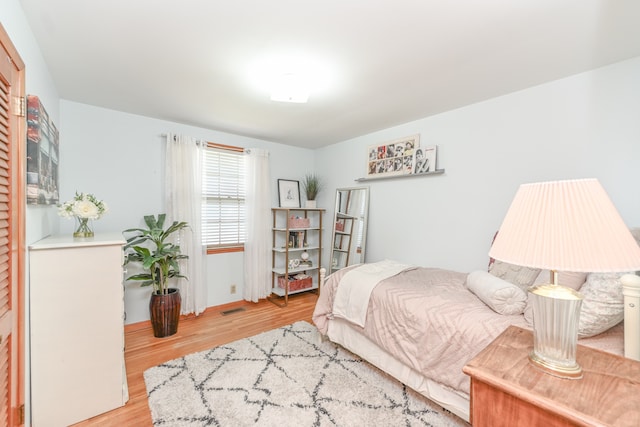 bedroom with light wood-type flooring