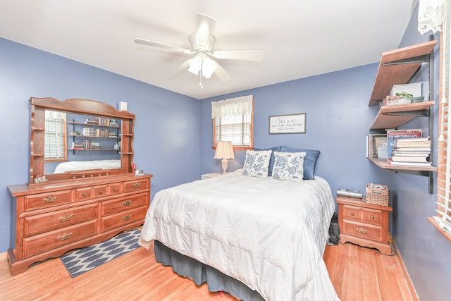 bedroom featuring ceiling fan and hardwood / wood-style flooring