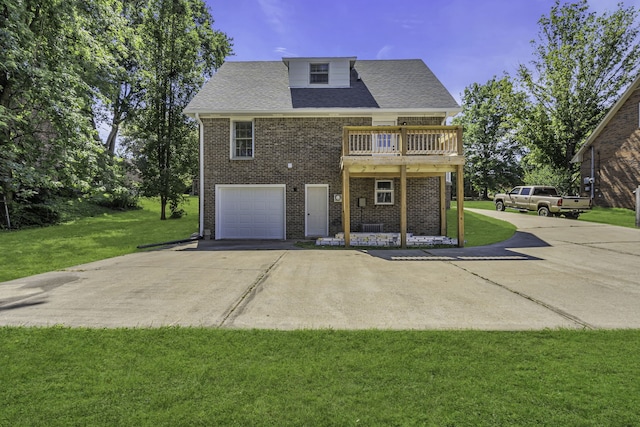 view of front of property with a front yard and a garage