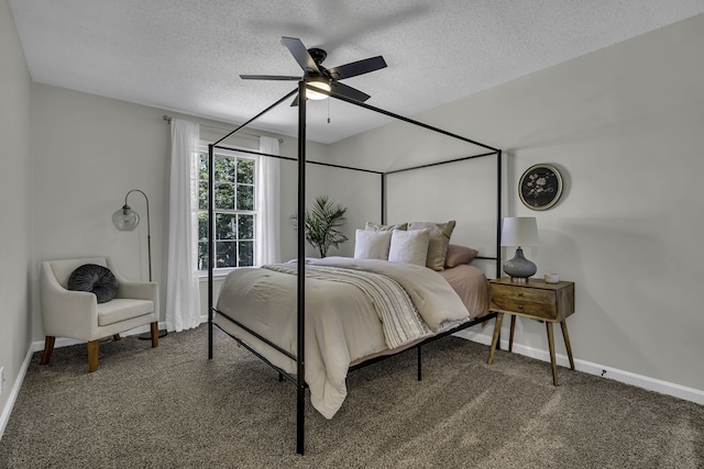 carpeted bedroom featuring ceiling fan and a textured ceiling