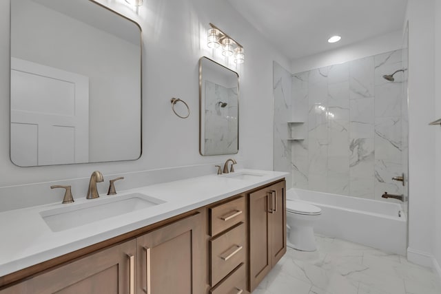 full bathroom featuring tile flooring, double sink vanity, toilet, and tiled shower / bath combo