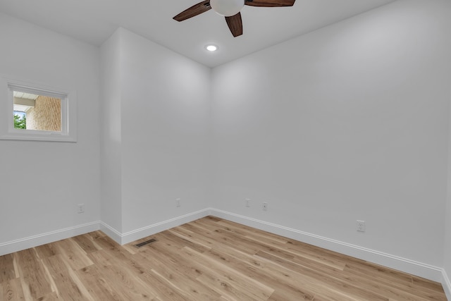 spare room featuring ceiling fan and light hardwood / wood-style floors