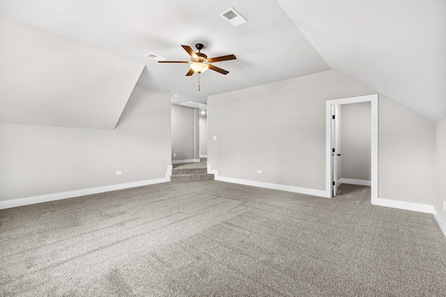 additional living space featuring light carpet, lofted ceiling, and ceiling fan