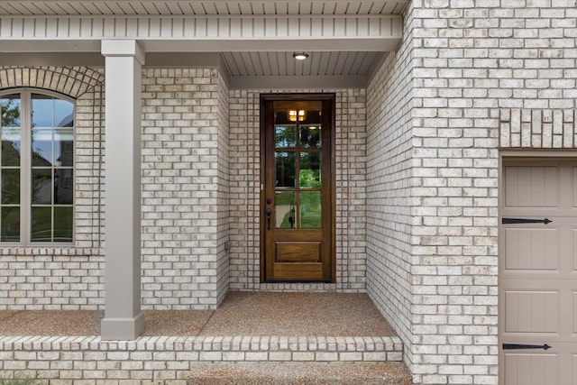 property entrance with a garage