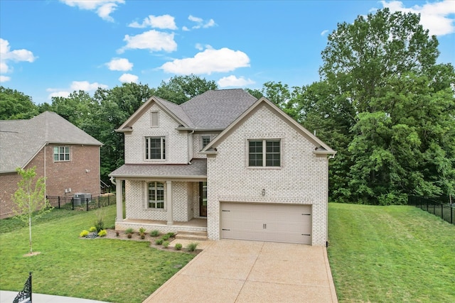 view of front of property featuring a front lawn and a garage