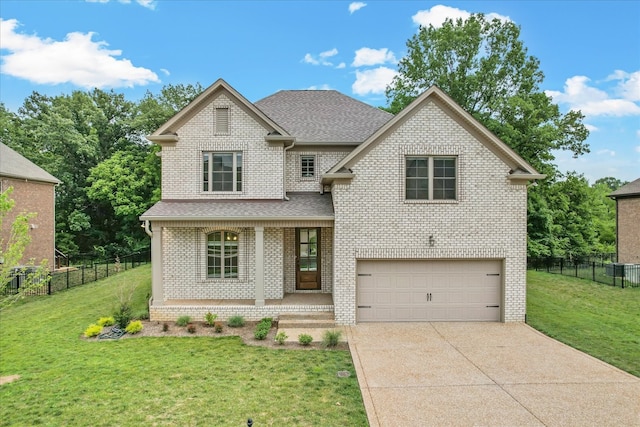 view of front of house with a front yard and a garage