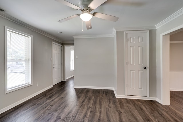 unfurnished room with ceiling fan, ornamental molding, and dark wood-type flooring