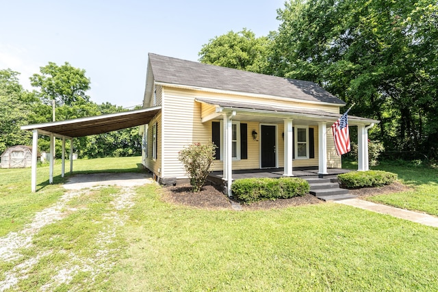 view of front of home with a carport, covered porch, and a front lawn