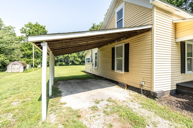 exterior space featuring a storage unit and a carport