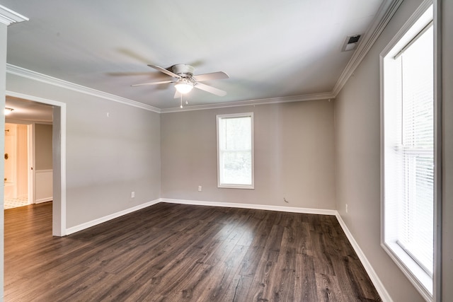 spare room featuring dark hardwood / wood-style floors, ornamental molding, and ceiling fan