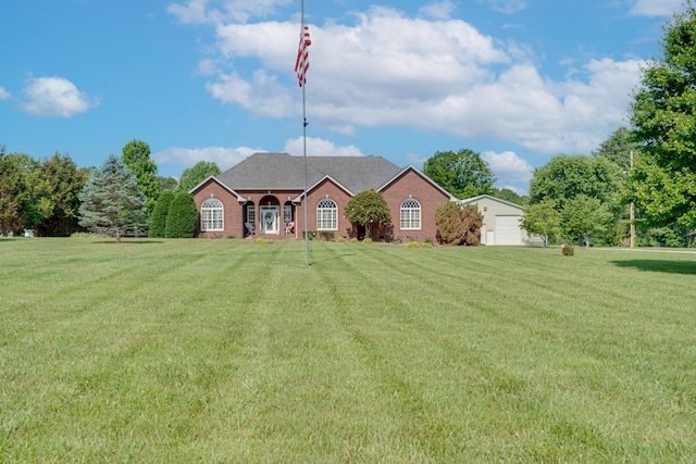 single story home featuring a front lawn